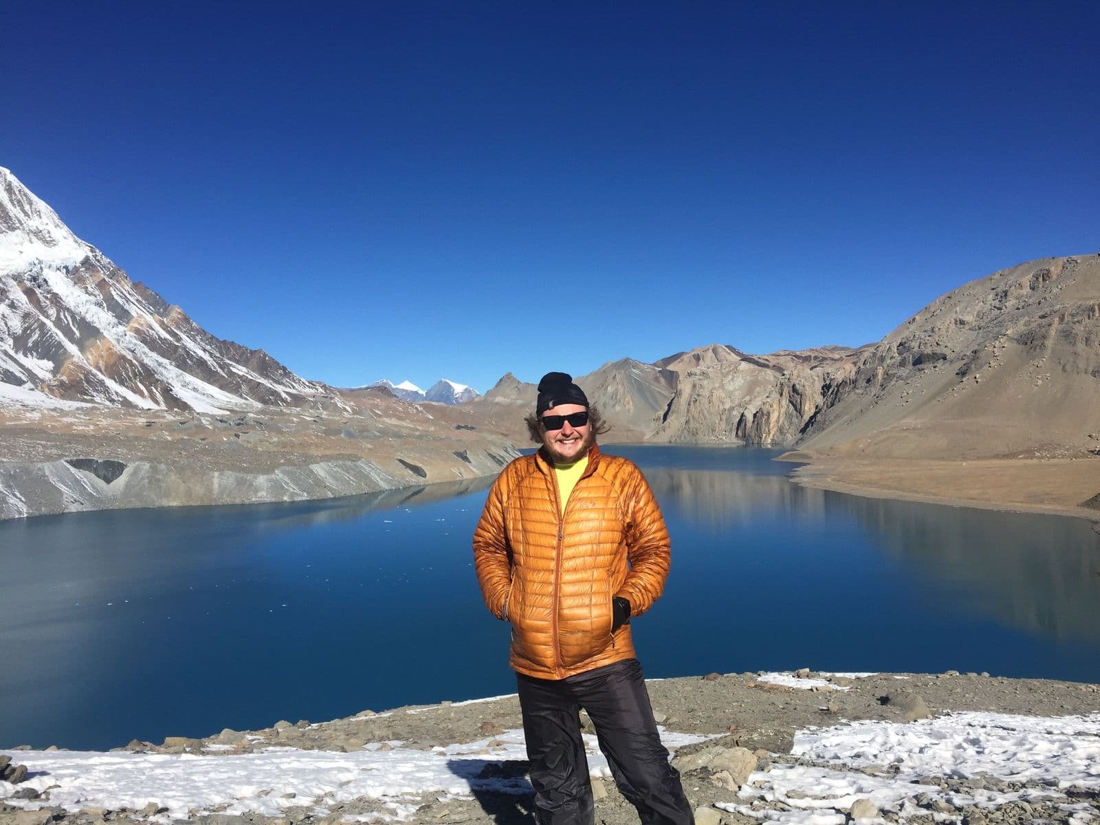 Trekker in front of Tilicho Lake