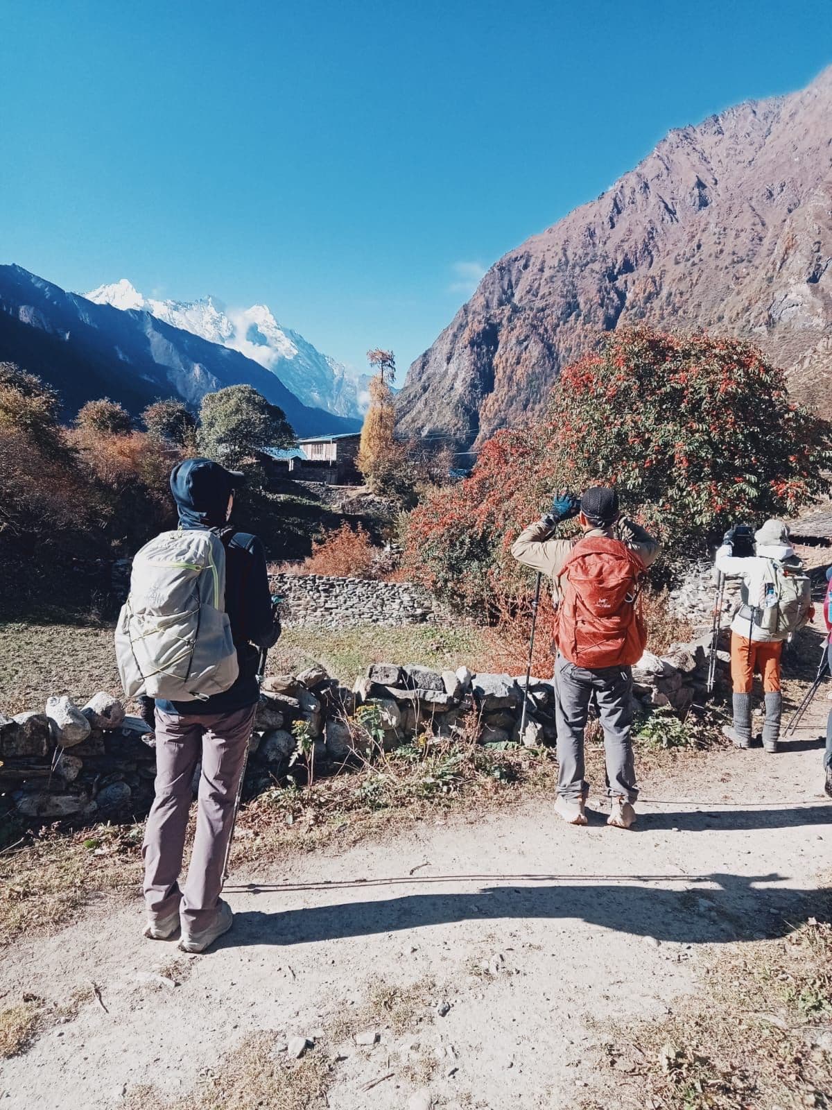 Trekkers on a dusty mountain trail