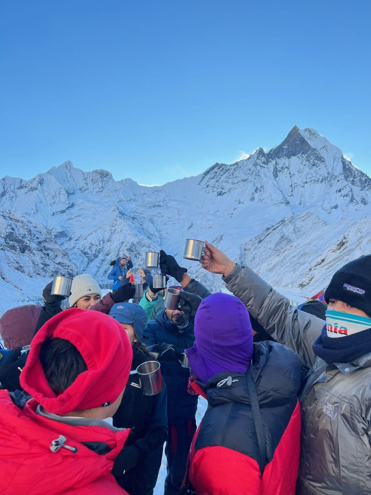 Trekkers watching sunrise on Machhapuchhre from Annapurna Base Camp